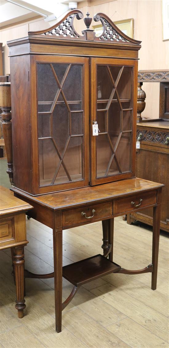 An Edwardian inlaid mahogany bookcase on associated two drawer base W.89cm